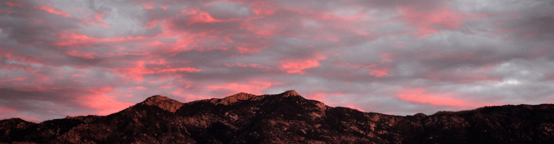 pink and gray sunset over the mountains