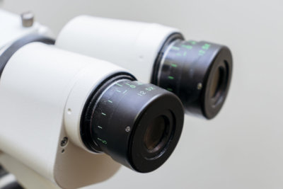 mircoscope oculars used in ophthalmology and optometry close up on solid white background