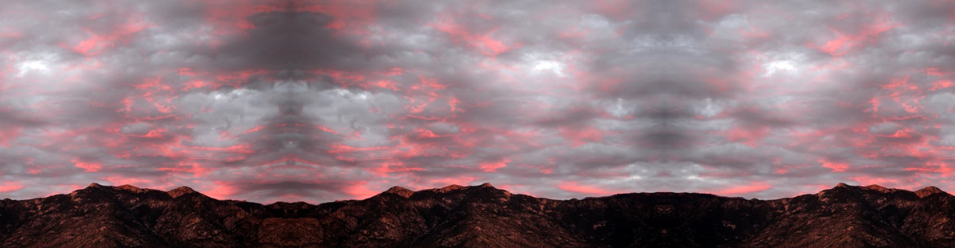 Electric pink sunset over the catalina mountains in Tucson, Arizona